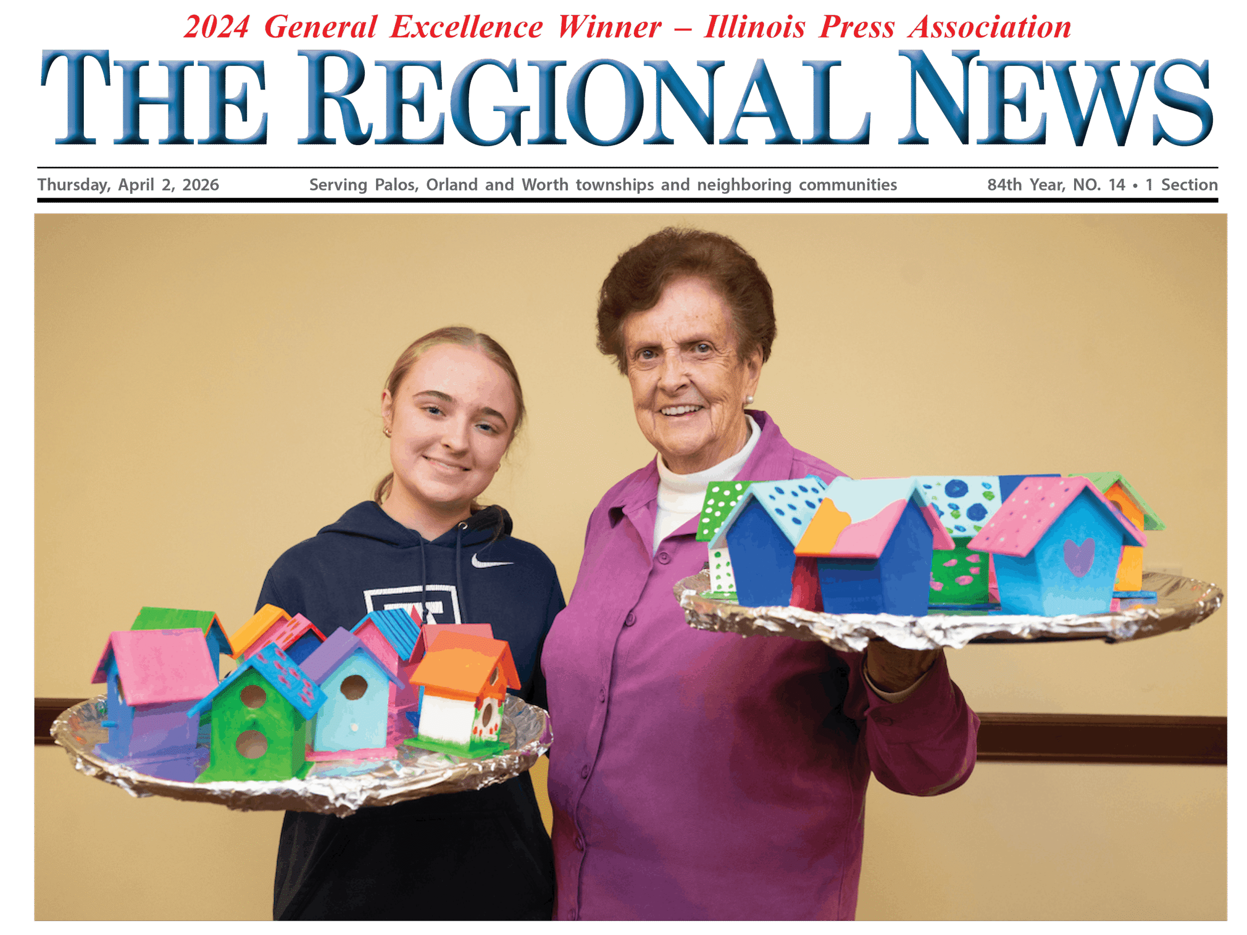 McAuley student with Mercy Circle resident holding birdhouses
