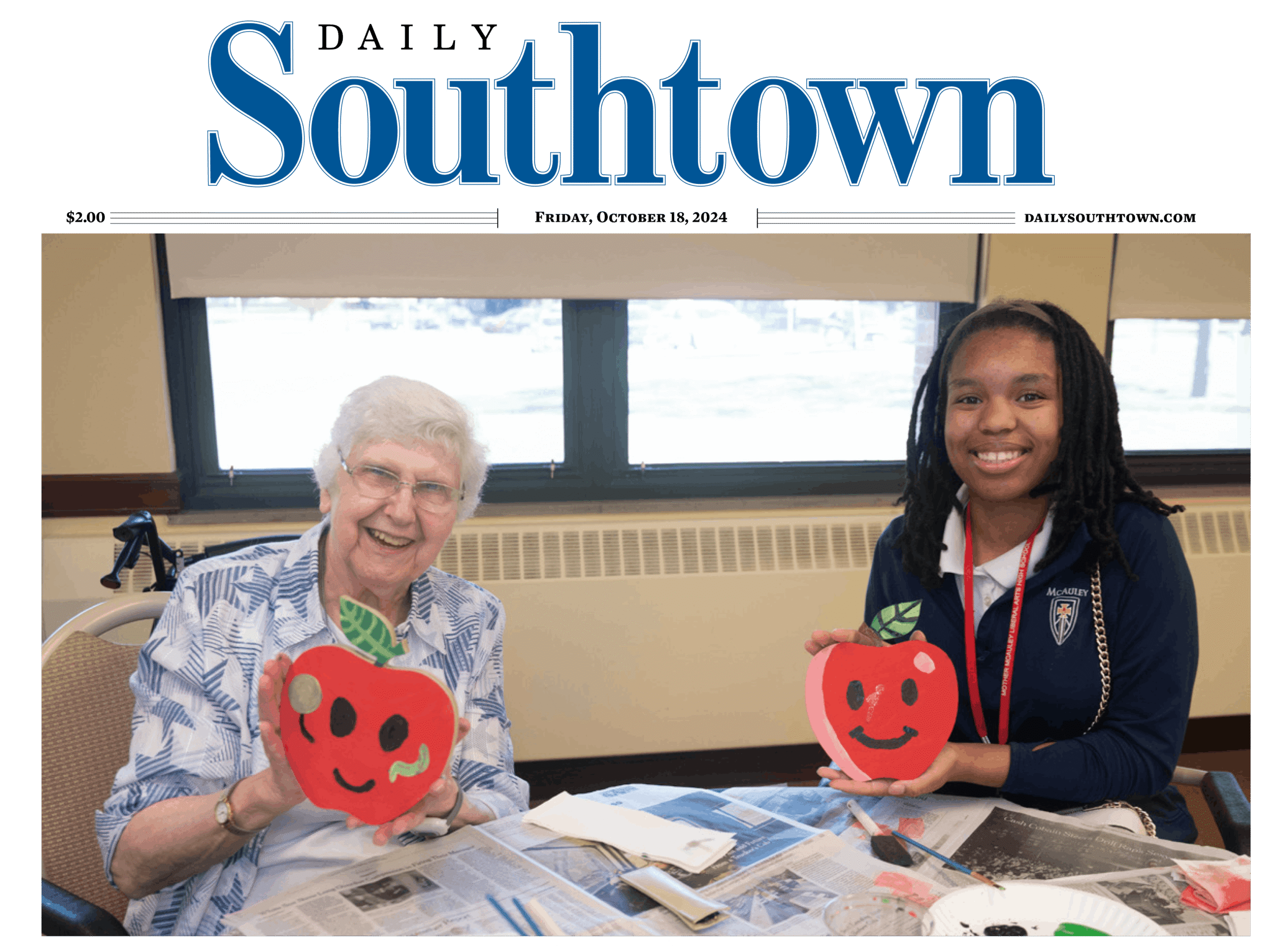 Mercy Circle resident and McAuley student show off their art project
