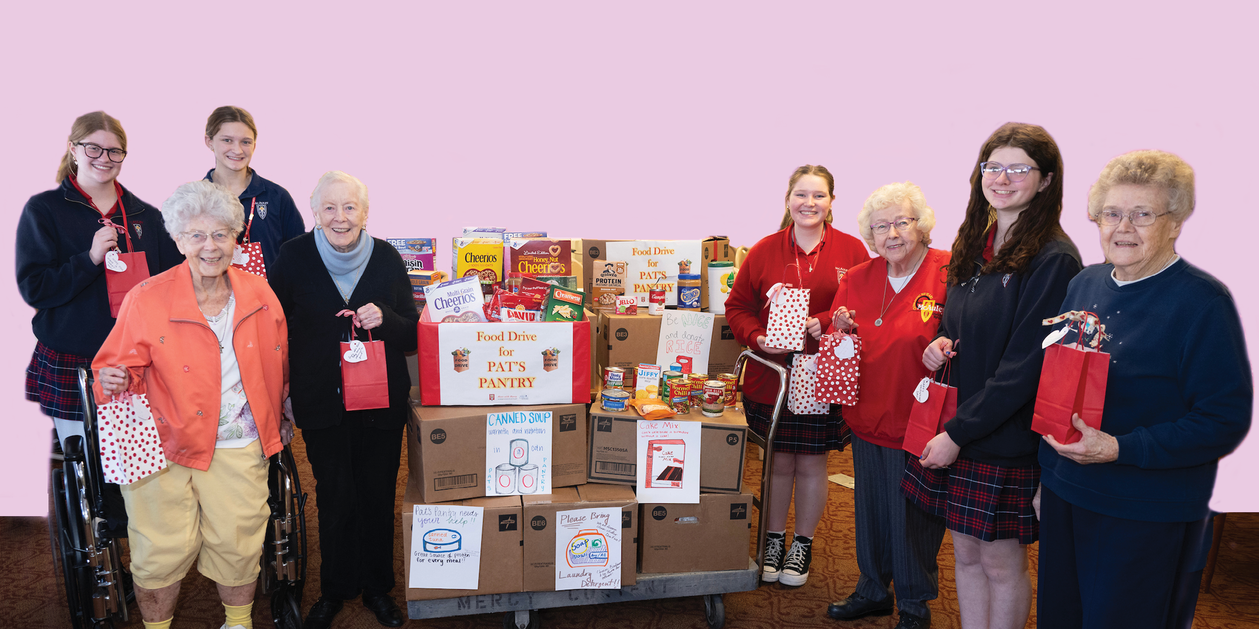 MC 2026.07.25 Home page #4 Group of people standing near donations for Pat's Pantry